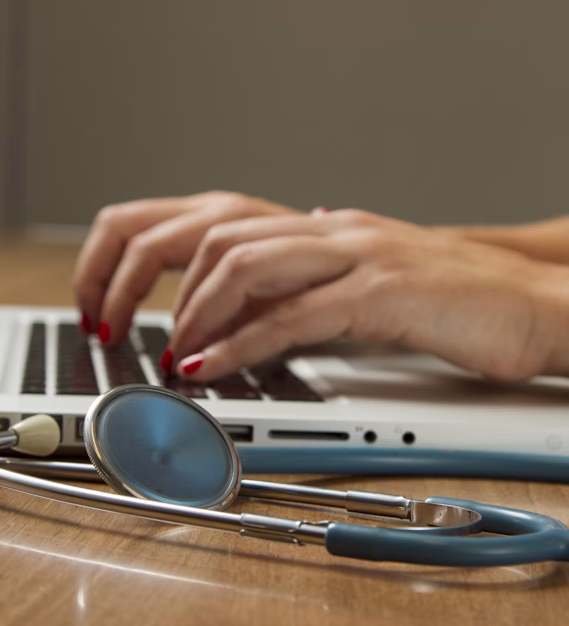 Provider reviewing billing documentation at a workstation